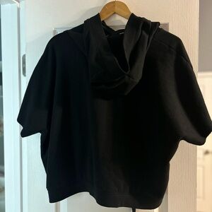 Short sleeve, hooded sweatshirt. Large. Hits at the hip.